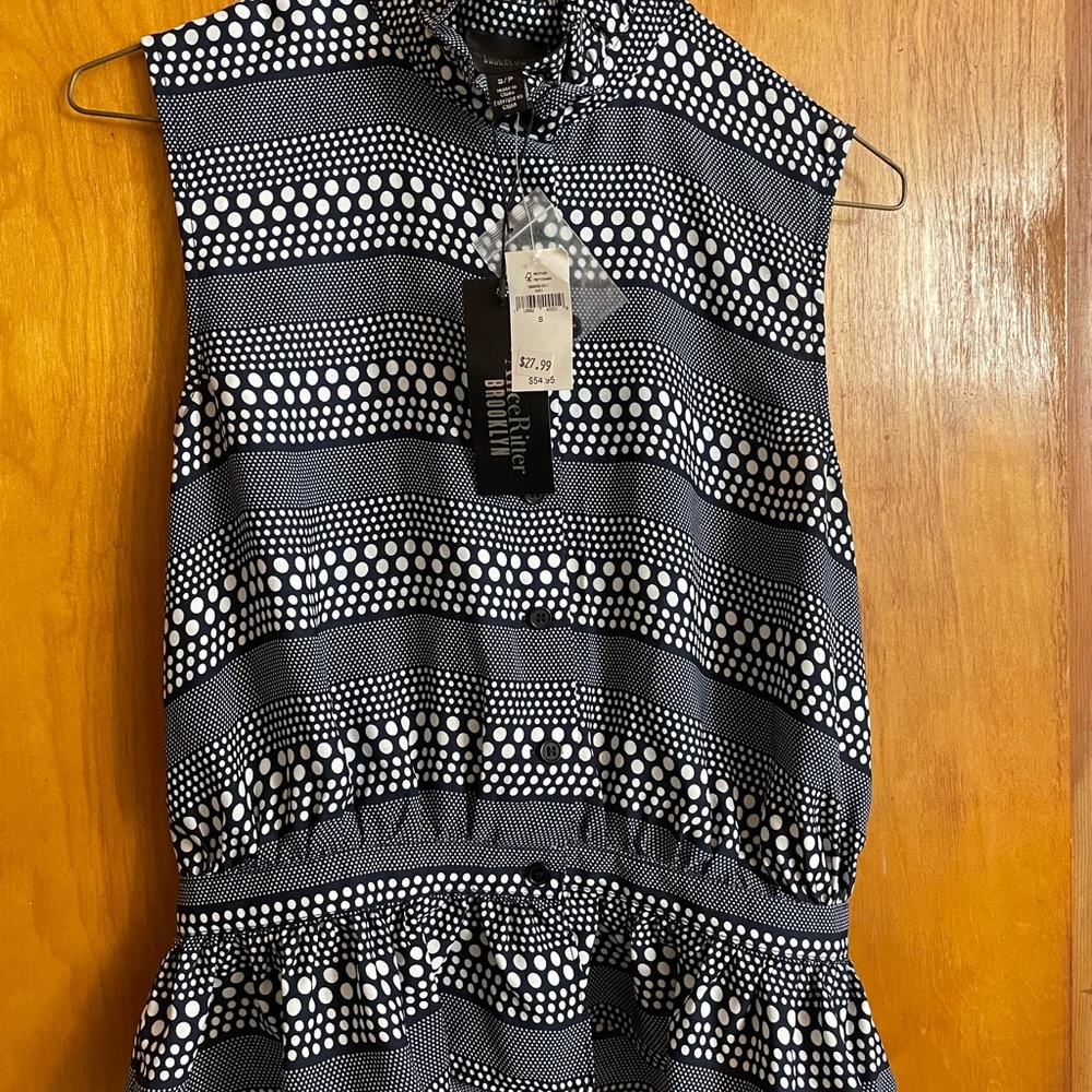 Black (dark navy — what I see, AI sees black) and White Polka Dot Sleeveless Top
